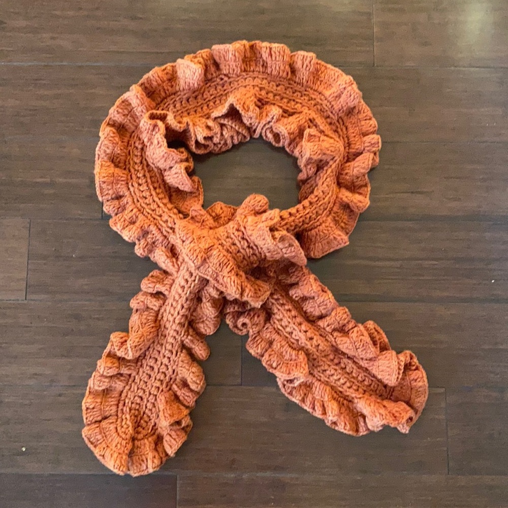 Orange knit scarf. NWOT